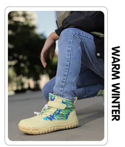 Close-up of children's warm winter snow boots with anti-slip soles and velcro straps