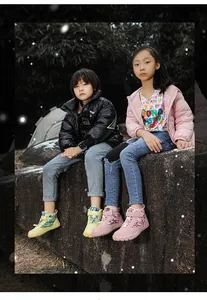 Children outdoors wearing waterproof winter barefoot boots with non-slip high-top design