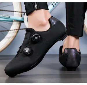 Detail of dual rotary knobs and perforated upper on black professional cycling shoes