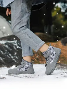 Detailed view of grey children's snow boots with star patterns and plush lining