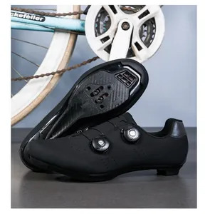 Detail of dual-dial cycling shoes with carbon fiber textured sole and perforated upper
