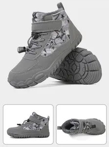 Detail of children's grey snow boots showing non-slip rubber sole and warm faux fur lining
