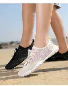 Close-up of breathable mesh water shoes with adjustable quick-lace toggle and grip sole