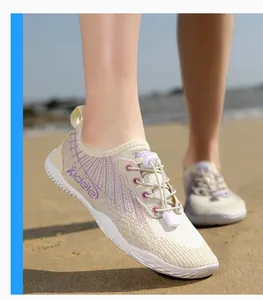 Breathable off-white water shoes with purple accents and quick-lace system for beach sports