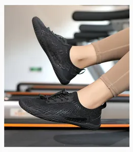 Close-up of black breathable mesh water sports shoes used on a fitness treadmill