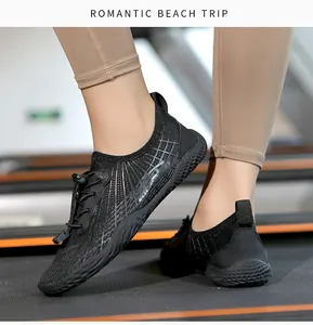 Detail of black quick-dry water shoes with mesh texture and anti-slip sole on treadmill