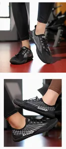 Close-up of lightweight black water sports shoes with quick-lace system and mesh fabric