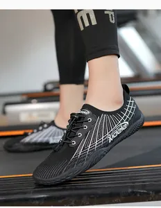 Detail of breathable mesh water shoes with non-slip rubber sole on a treadmill