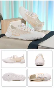 Detail view of white water shoes featuring quick-lace system and anti-slip rubber outsole