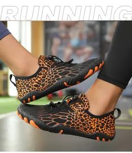 Detail of five-finger barefoot shoes with leopard pattern and quick-lace system