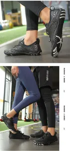 Close-up of non-slip barefoot shoe sole and couple wearing quick-dry water shoes in gym