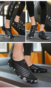 Detail of breathable mesh upper and camouflage sole on professional outdoor wading shoes
