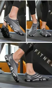 Detail of gray quick-dry fitness shoes with anti-slip camouflage rubber sole on a treadmill