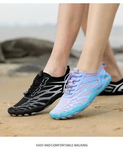 Close-up of quick-dry water shoes with breathable mesh and anti-slip soles on a beach