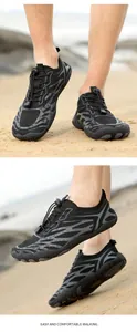 Detail of black water shoes with tiger pattern, quick-lace system and non-slip sole