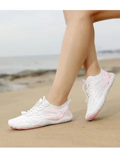Breathable white and pink quick-dry water shoes with non-slip rubber sole for beach sports