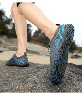 Detail of grey quick-dry water shoes with anti-slip rubber sole and blue accents