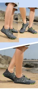 Detail of gray quick-dry water shoes with neon green non-slip rubber sole on beach sand