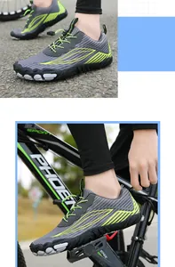 Close-up of grey hiking shoes on bicycle pedals showing anti-slip rubber soles and quick-lace