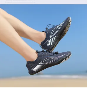 Detail view of navy blue mesh water shoes with non-slip rubber sole and speed lacing system