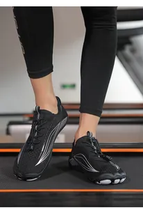 Action shot of breathable quick-dry barefoot shoes worn on a treadmill for gym training