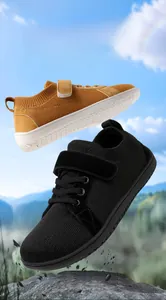 Dynamic view of breathable wide-toe kids barefoot shoes in yellow and black mesh