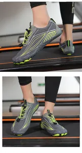 Macro detail of breathable mesh and quick-lace system on grey water shoes for gym