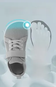Macro view of gray toddler barefoot shoes featuring wide toe box and breathable mesh fabric