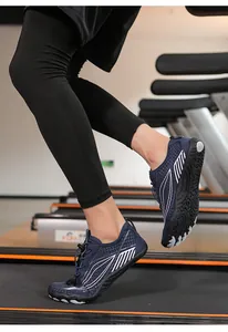 Action shot of dark blue barefoot gym shoes with breathable mesh on a treadmill