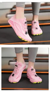 Pink quick-dry water shoes on treadmill showing breathable mesh and non-slip rubber soles