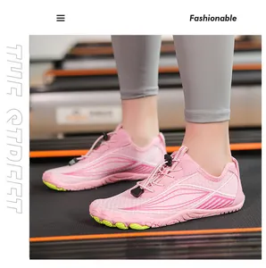 Pink quick-dry water shoes with green non-slip soles used on a gym treadmill