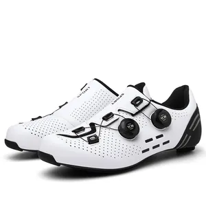 Close-up of white breathable road cycling shoes with dual rotary knob closure system