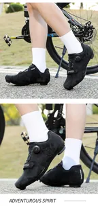 Detail of black cycling shoes with rotary dial and velcro straps for road biking
