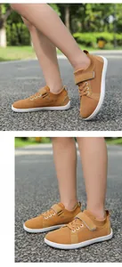 Close-up of kids barefoot shoes with breathable brown mesh and easy velcro strap