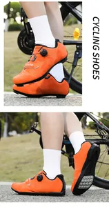 Close-up of bright orange cycling shoes featuring rotary dial closure and breathable vents