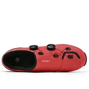 Detail of red carbon fiber cycling shoe with dual MOA rotary knobs and sport perforation