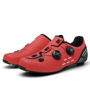 Close-up of red carbon fiber cycling shoes with dual rotary buckle and breathable vents