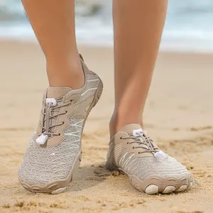 Khaki breathable quick-dry water shoes for men and women on a sandy beach setting