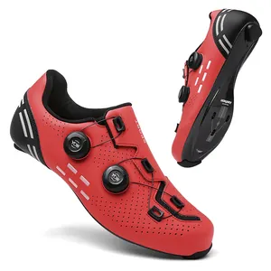 Detail of red cycling shoes with dual rotary dials and carbon composite sole