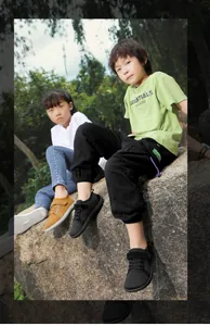 Detail of breathable mesh kids' barefoot shoes with velcro straps in black and ginger yellow