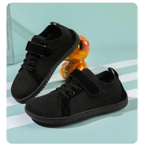 Detail of children's wide barefoot sneaker with breathable mesh and velcro strap