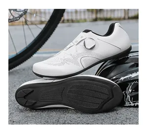 Detail of white road bike shoes with breathable laser perforations and rotary dial system