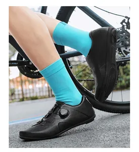 Detail of professional black cycling shoes with knob lacing and breathable vent holes