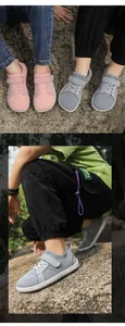 Detail view of breathable mesh toddler shoes in pink and grey with velcro straps