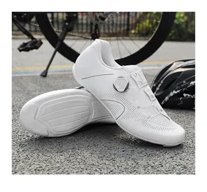 Outdoor macro view of white road cycling shoes with breathable laser-perforated upper detail