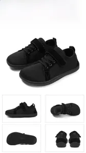 Detail view of black barefoot sneakers with breathable mesh, velcro and non-slip sole