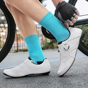White professional road cycling shoes with quick dial system and breathable laser-cut holes