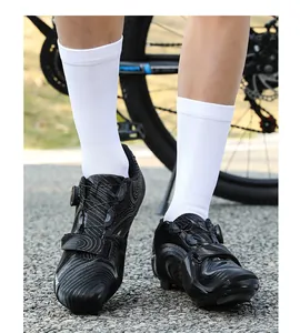 Detail of professional cycling shoes with rotary buckle and white wave patterns