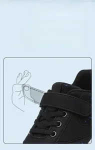 Close-up of children's wide-toe barefoot sneaker with adjustable hook and loop closure