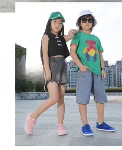 Children outdoors wearing breathable barefoot sneakers and casual summer street outfits